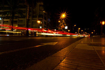 trails of light on the dark street of salou