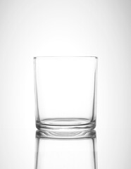 Empty glass on gradient white background