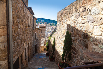 Rough stone walls of an ancient medieval fortress. Massive fortifications.