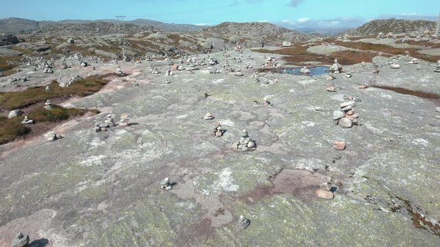 Beautiful nature with stone mounds on sunny day in summer close to Lysebotn town in Norway