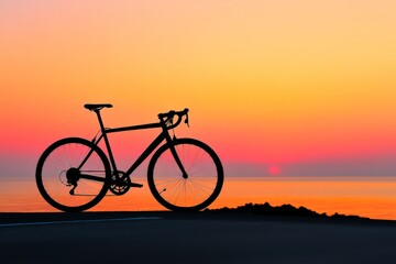 Fototapeta premium Serene Sunset Silhouette of a Road Bicycle by the Sea