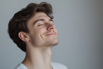 Fototapeta premium A close up of a man's face with his eyes closed