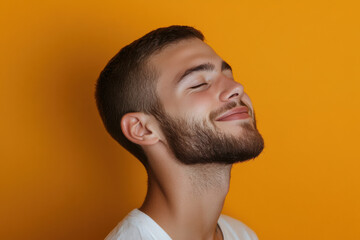 Obraz premium A close up of a man's face with his eyes closed