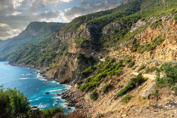 Vehicle road in the mountains descending perpendicularly to the sea between Alanya and Anamur in the Mediterranean