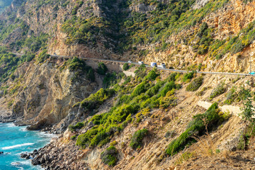 Obraz premium Vehicle road in the mountains descending perpendicularly to the sea between Alanya and Anamur in the Mediterranean