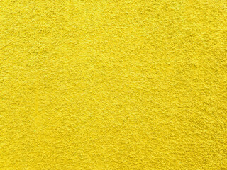 Fototapeta premium Yellow Surface Cement Wall Painted Texture. Abstract rough cement wall background.