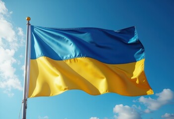 Bright Ukrainian flag waving against a clear blue sky on a sunny day
