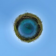 Little planet in the blue sky, 360 degree spherical panorama.