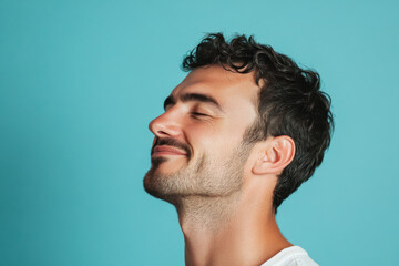 Fototapeta premium A close up of a man's face with his eyes closed