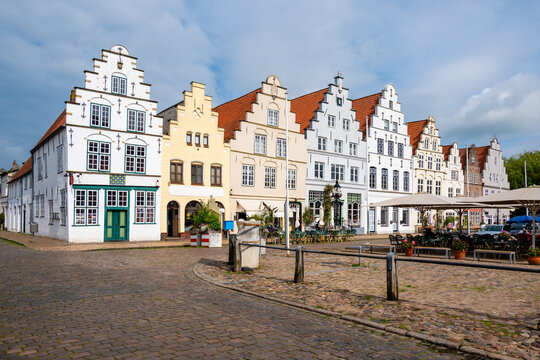 Houses with stepped gables on the west side of the historic market square in Friedrichstadt; Germany