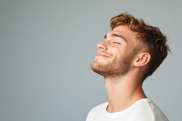 Obraz premium A close up of a man's face with his eyes closed