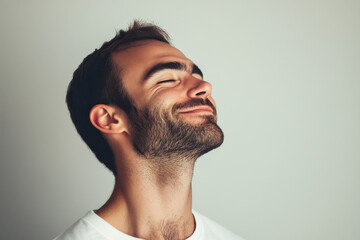 Obraz premium A close up of a man's face with his eyes closed