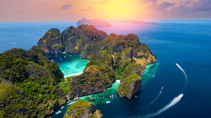Aerial top view sunset Maya Bay in island Phi Phi Leh, turquoise clear water in Krabi Thailand....