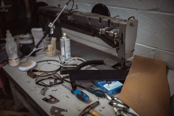 Sewing machine in a corner of classic cars trimming workshop
