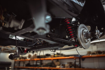 Classic cars being restored in a vintage vehicle garage workshop