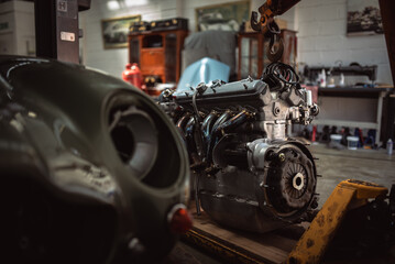 Classic cars being restored in a vintage vehicle garage workshop