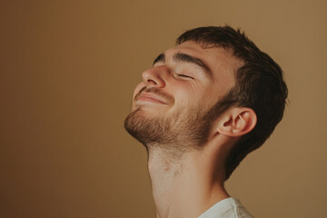 Obraz premium A close up of a man's face with his eyes closed