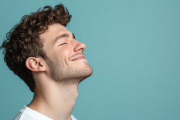 Fototapeta premium A close up of a man's face with his eyes closed