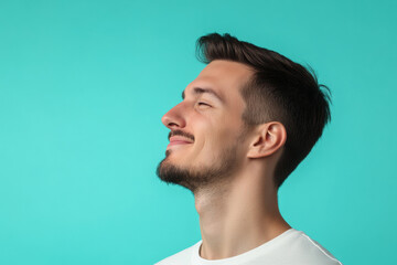 Obraz premium A close up of a man's face with his eyes closed