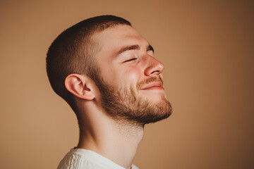 Obraz premium A close up of a man's face with his eyes closed