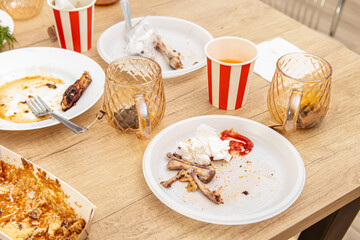 Leftovers from the party. Dirty dishes and half-eaten food