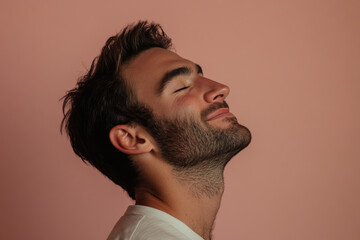 Obraz premium A close up of a man's face with his eyes closed