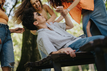 Group of young friends having fun and enjoying each other's company in a sunny park. Happy moments and outdoor activities.
