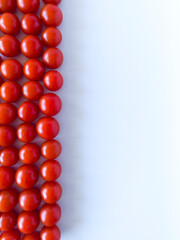 Small cherry tomato line up isolated on the white background