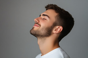 Obraz premium A close up of a man's face with his eyes closed
