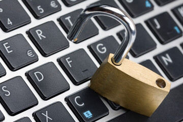 open padlock on keyboard cyber security internet concept violation