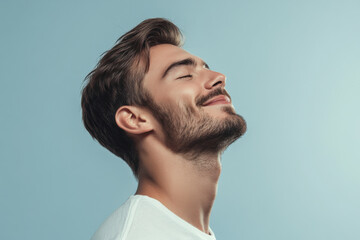 Obraz premium A close up of a man's face with his eyes closed