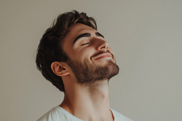 Obraz premium A close up of a man's face with his eyes closed