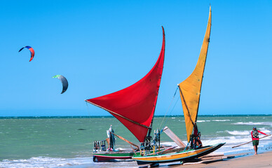 Jangada, or raft, a rustic wooden boat with a sail, typically used for fishing and recently for...