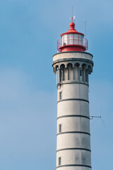 View of lighthouse, typical Portuguese architecture, with nice details and very particular framing, blue sky as background, located in Leça da Palmeira, Porto, Portugal. Matosinhos. Drone. Aerial view