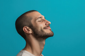 Fototapeta premium A close up of a man's face with his eyes closed