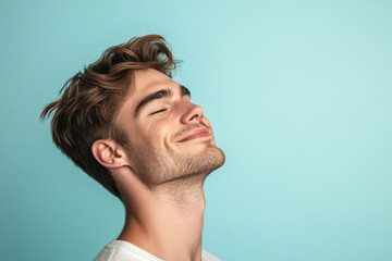 Fototapeta premium A close up of a man's face with his eyes closed