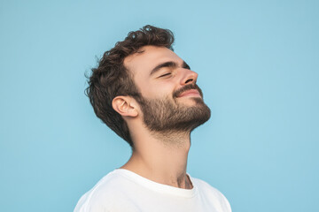 Obraz premium A close up of a man's face with his eyes closed
