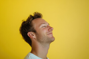 Obraz premium A close up of a man's face with his eyes closed