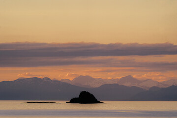 Stephen's Passage at sunset along Southeast Alaskan coastline along the inside passage in summer