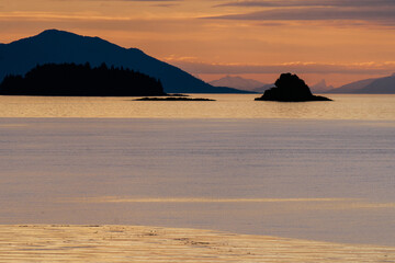 Stephen's Passage at sunset along Southeast Alaskan coastline along the inside passage in summer