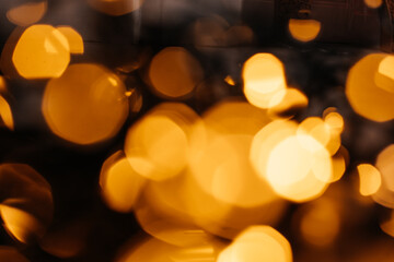 Abstract image of warm golden bokeh lights, creating a dreamy and festive ambiance.