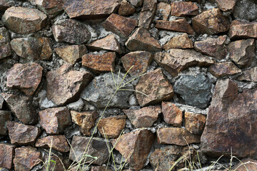 Background of stone wall texture. Old stone wall texture for background. Close-up of stone wall.