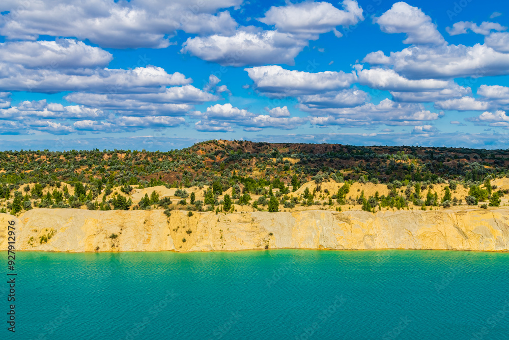 Wall mural lake with sandy shore in the abandoned coal quarry