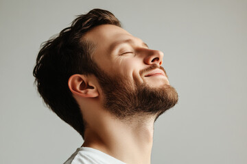 Fototapeta premium A close up of a man's face with her eyes closed