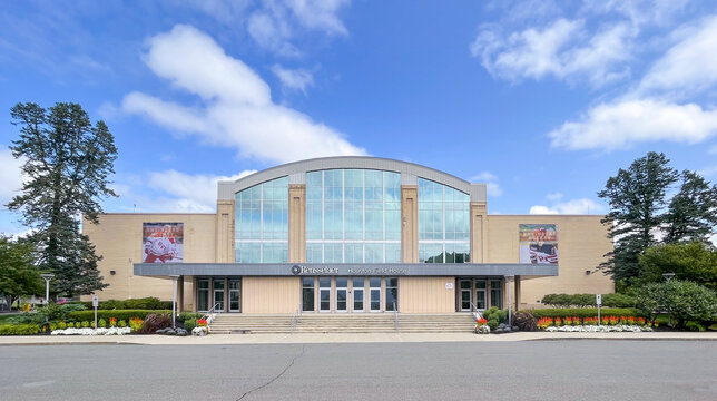 Troy, NY - USA: Front facade, entrance and stairs to the Houston Field House. Blue sky and clouds