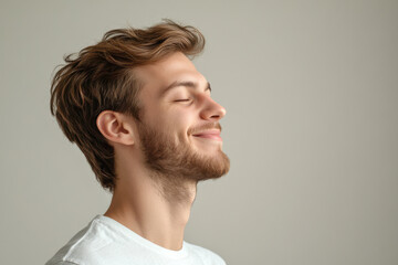 Fototapeta premium A close up of a man's face with his eyes closed