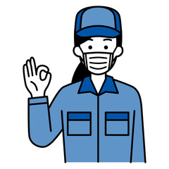 マスクを付けてOKサインをするつなぎ作業服の女性