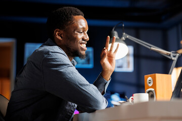 African american junior worker starts training session online with mentor, doing remote work and learning ways of solving his duties. Male trainee employee listening to trainer on videocall.