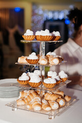 Dessert stand filled with pastries and sweets, perfect for a festive occasion or celebration.