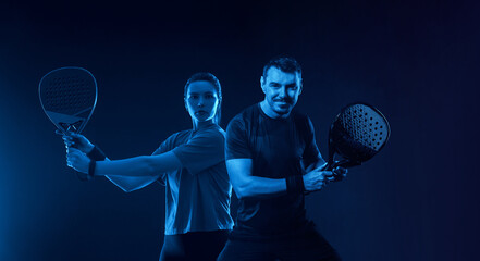Padel Players. Family team mx. Group of two mix padel tennis players with racket. Woman and man...